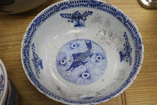 A 19th century Chinese blue and white punch bowl, Diameter 35cm. and three other bowls (a.f.)